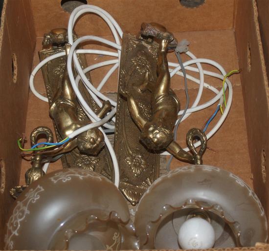Pair of brass putti wall lights